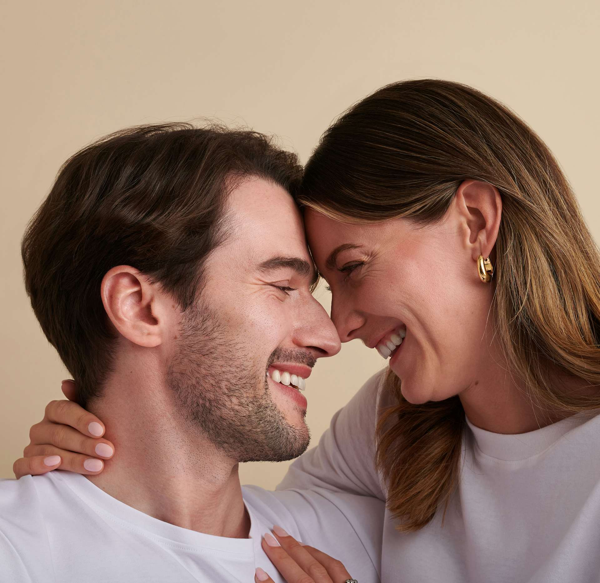 two people smiling at each other