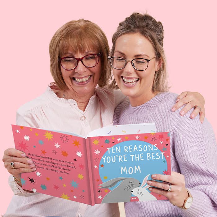 mother and grandmother reading book