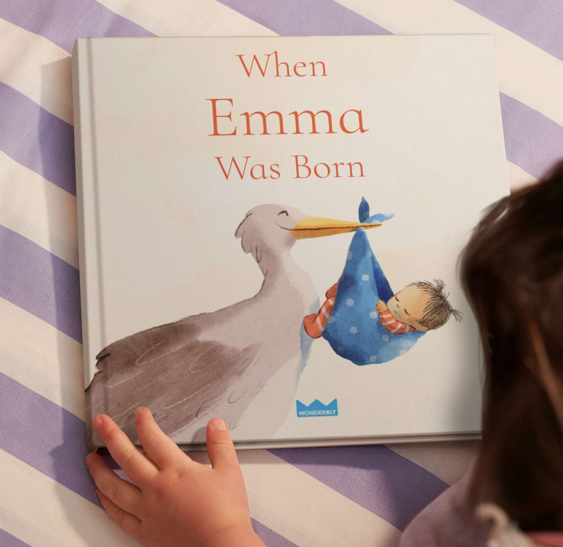 Child holding the personalised book