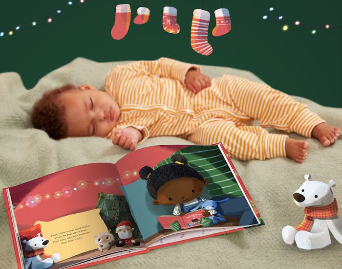 Baby sleeping next to the book