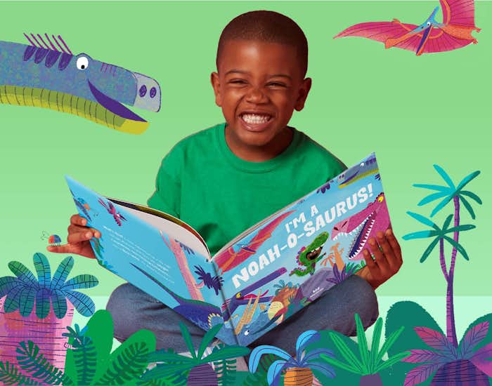 Child reading the book and smiling