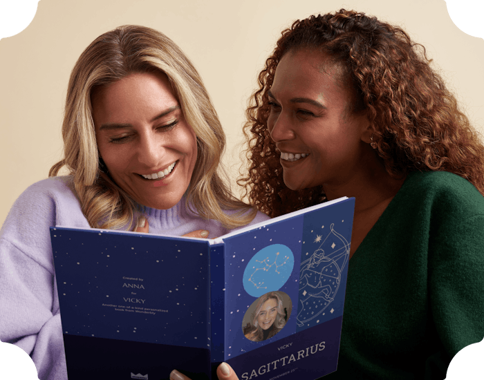 women reading astrology book