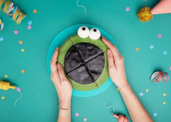 Birthday cake sliced into four 