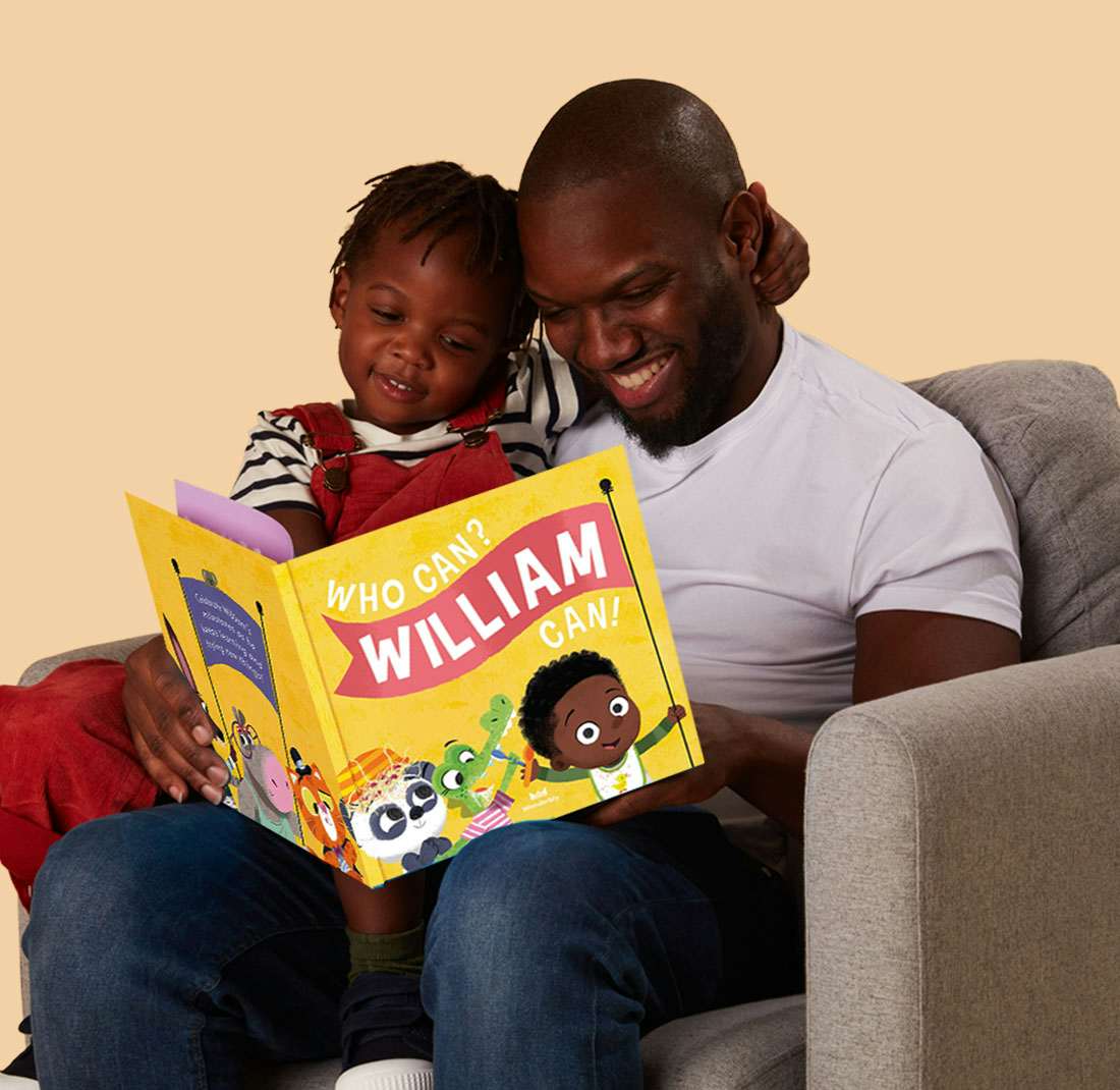 Father and son reading Who Can? You Can! together
