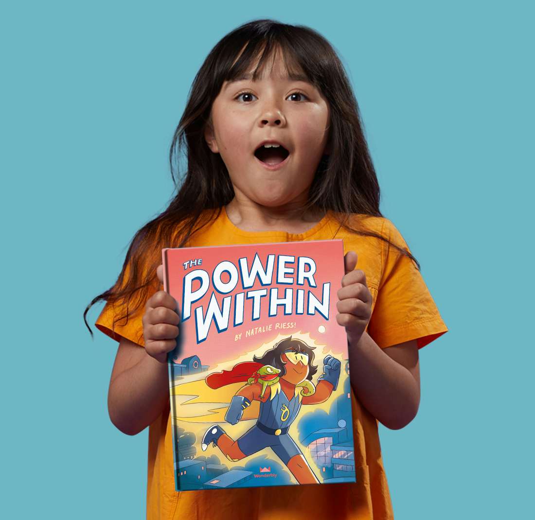 Little girl with her personalized copy of The Power Within