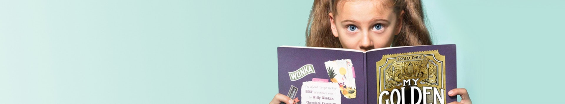 Young girl in awe, reading My Golden Ticket
