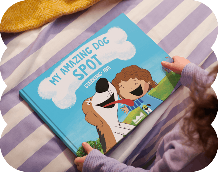 Child holding her personalised book