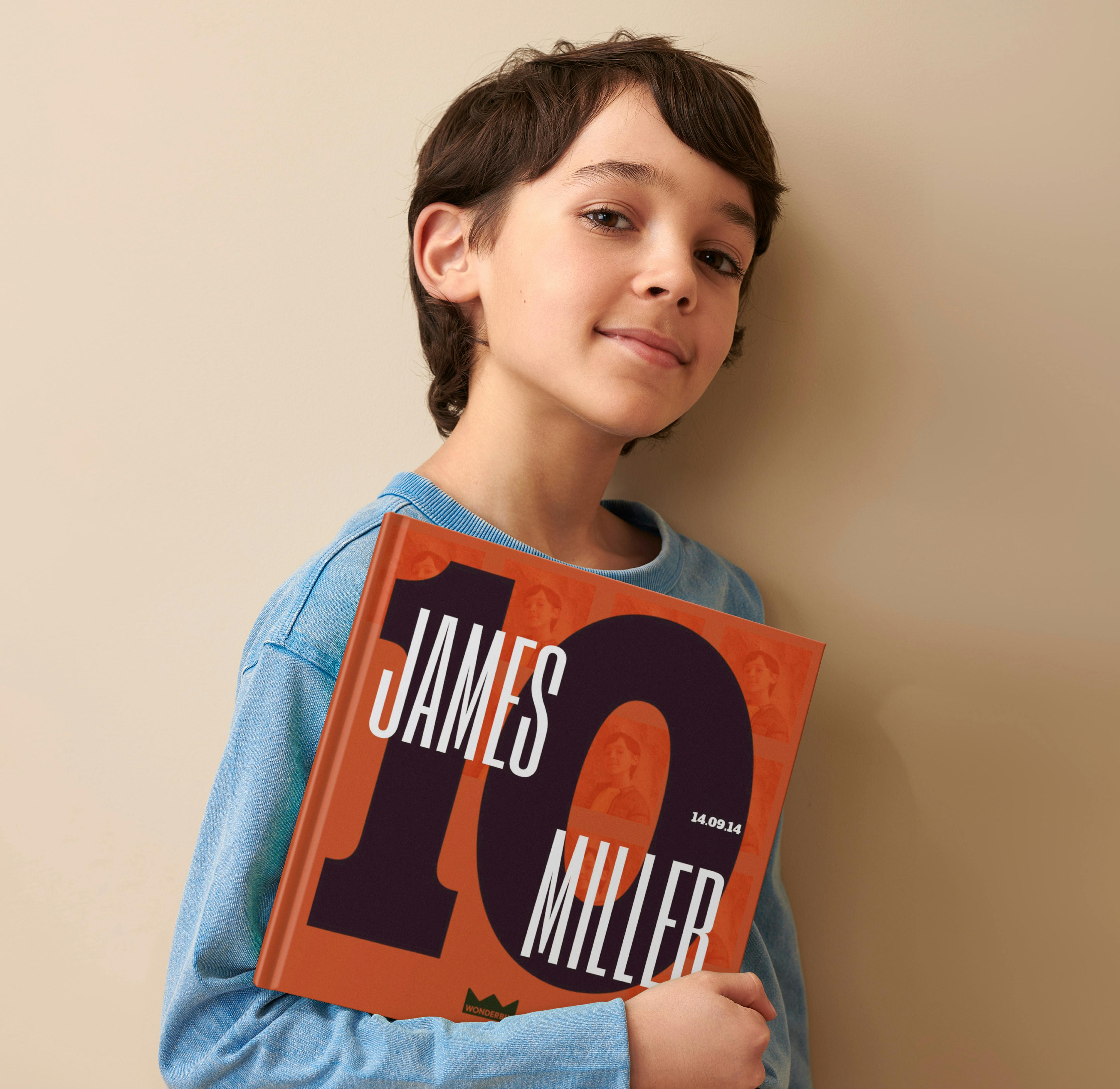 Child holding their personalised book
