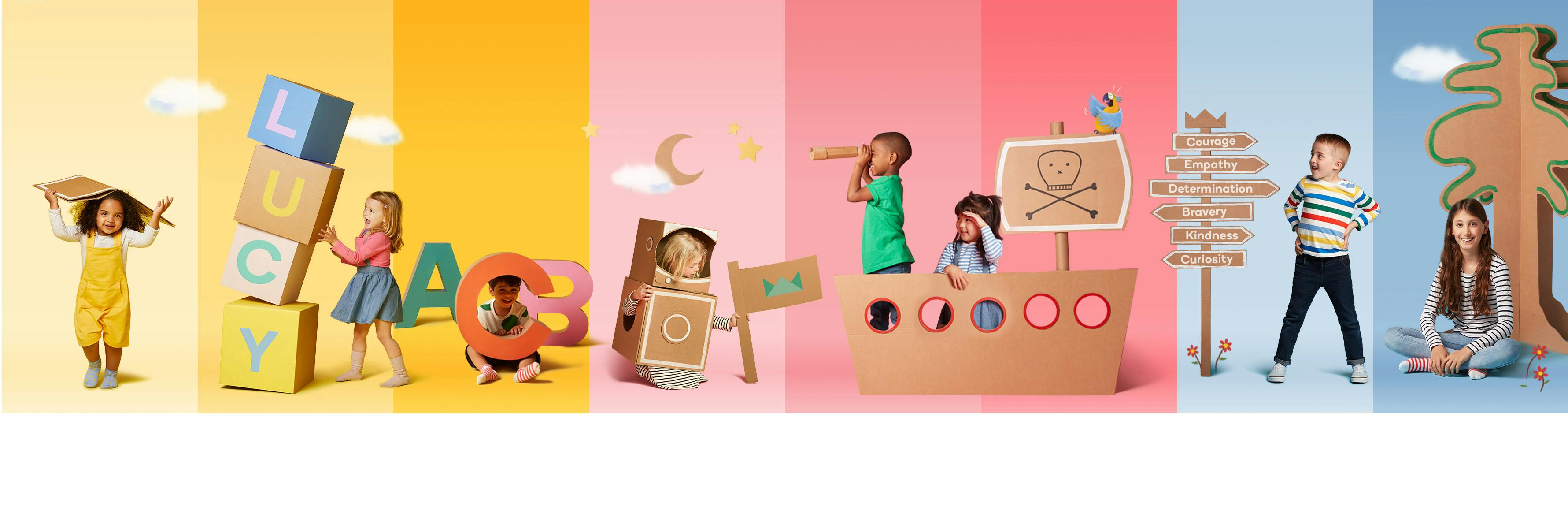 Children with cardboard books and letters