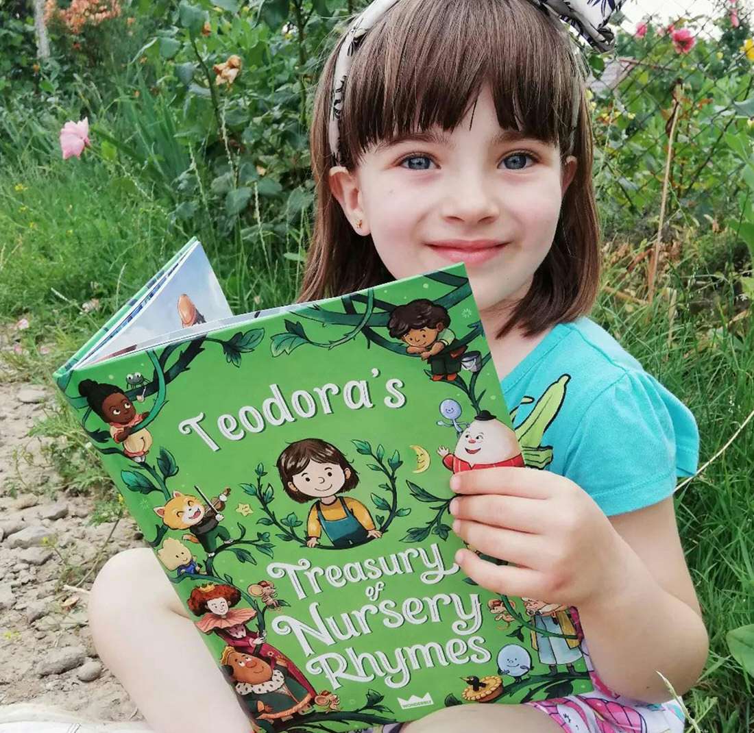 Child holding personalized book