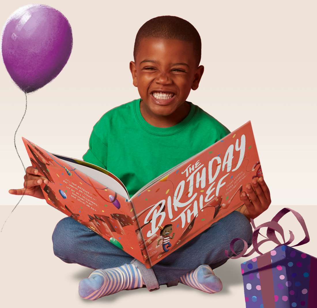 Little boy with his own personalized version of the book