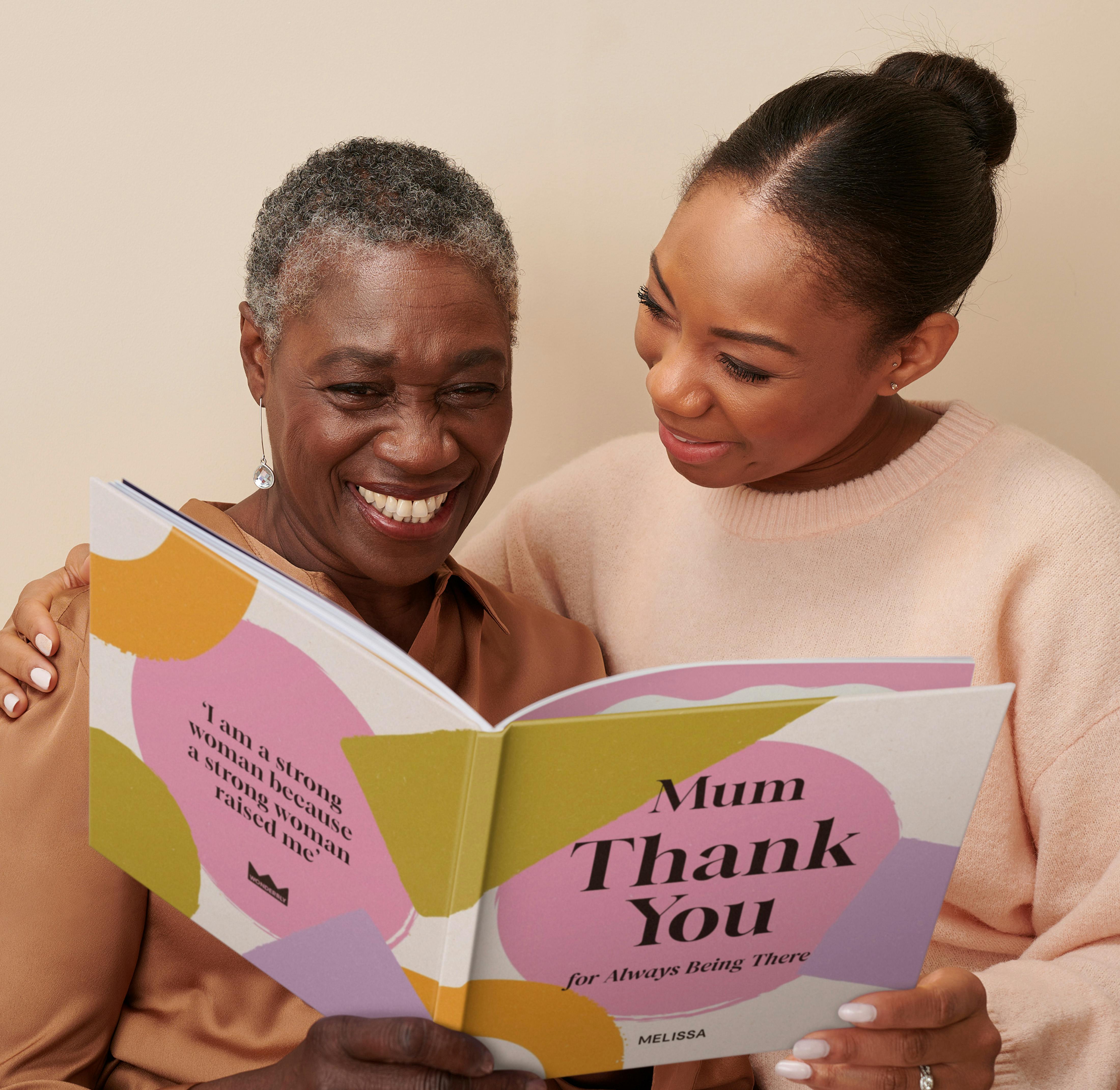 mother and daughter reading personalised book