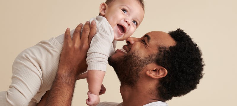 dad and kid hugging