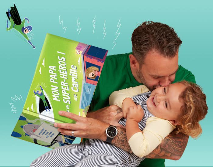 Father and daughter reading My Daddy The Superhero together