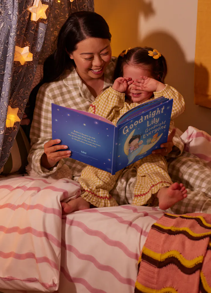Mother and child reading personalised book - Goodnight You, Goodnight Everyone