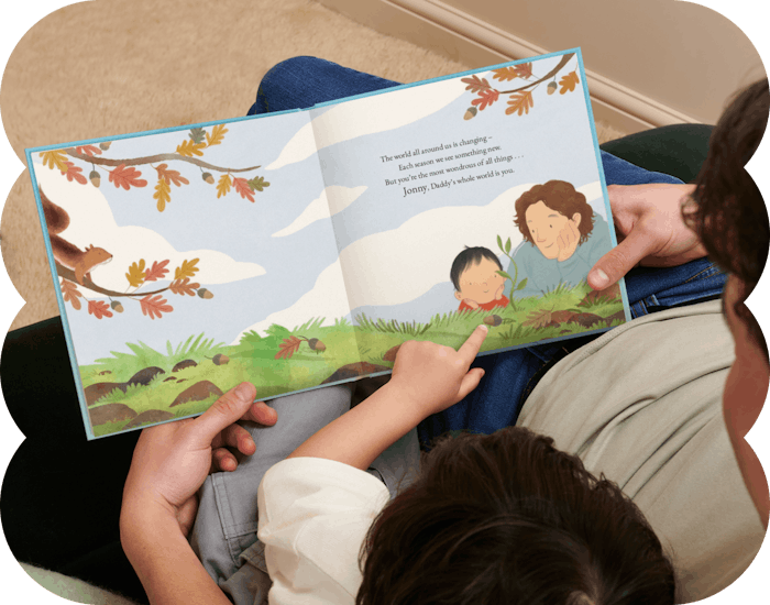 father and child reading personalised book