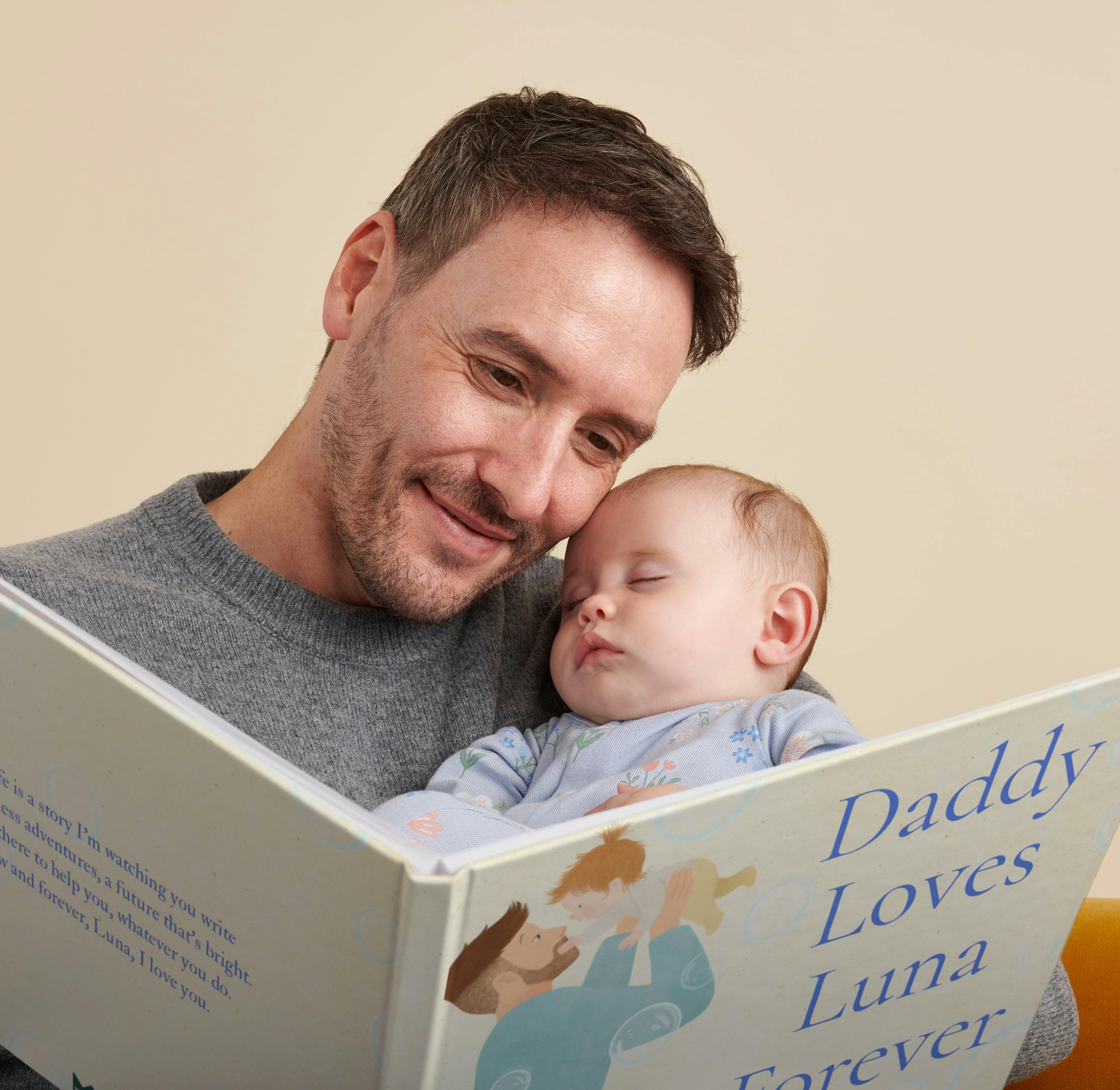 A child and father reading the personalised book