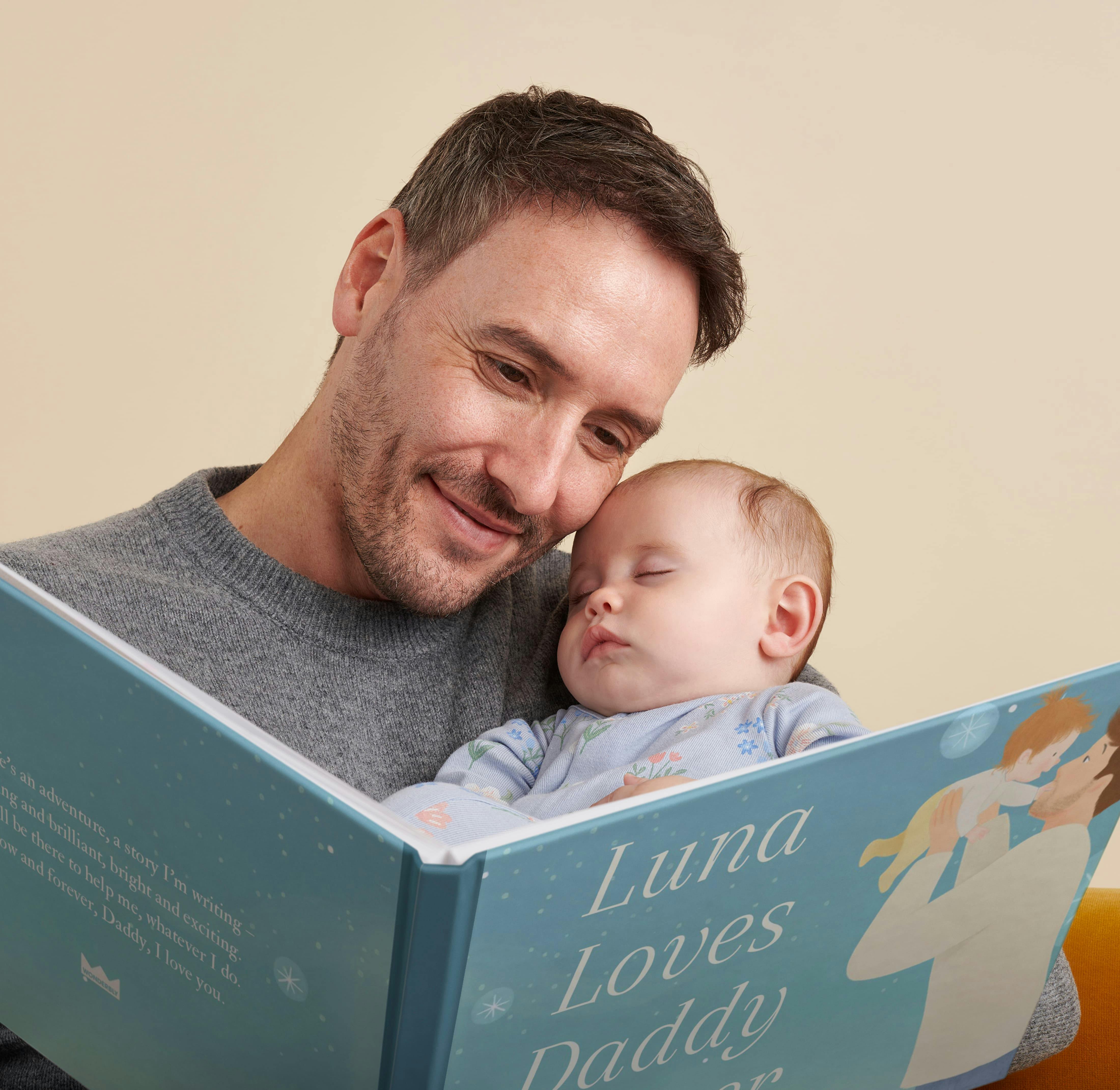 A child and father reading the personalised book