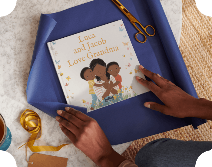 Two hands wrapping the personalised book