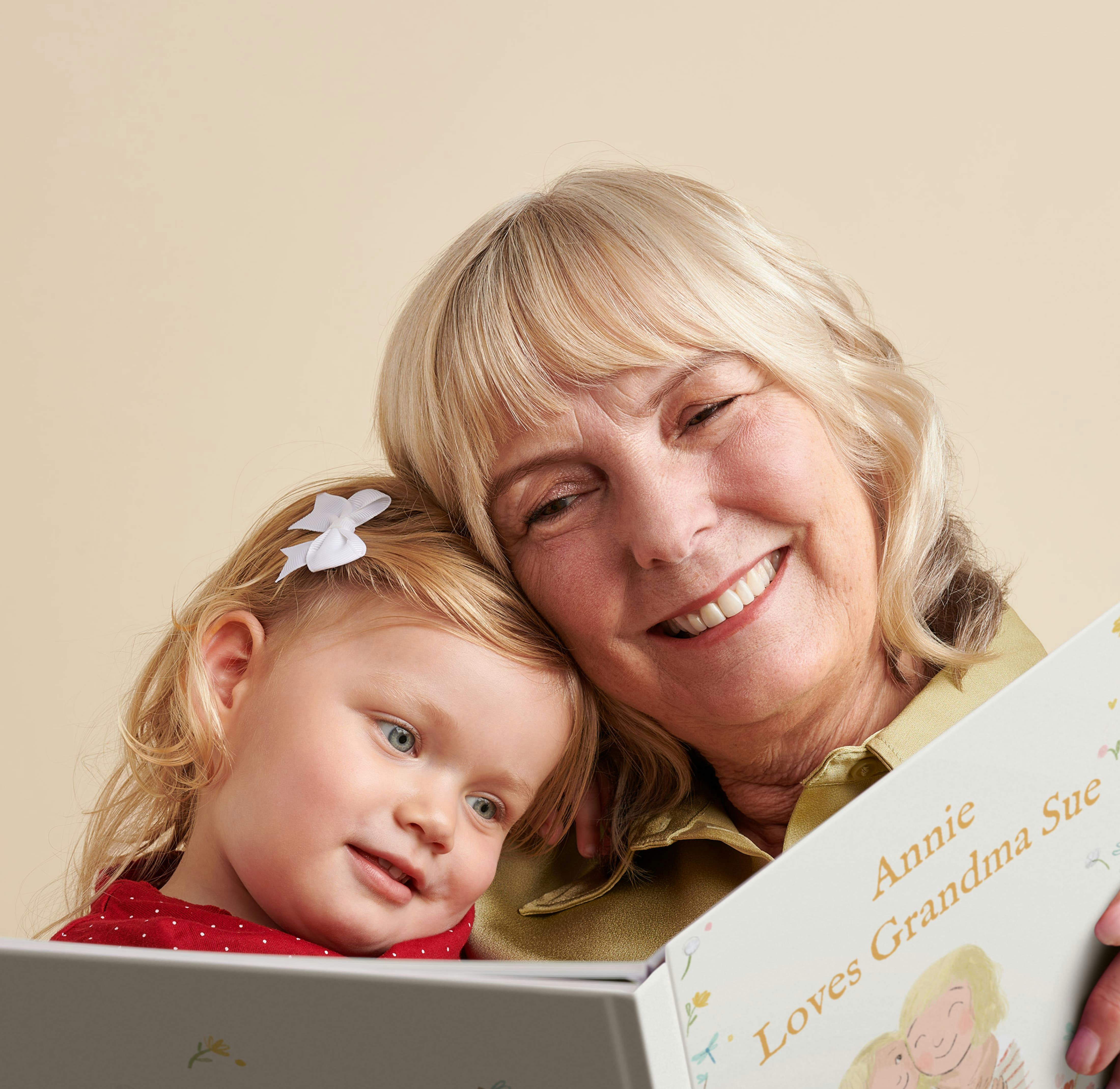 A child and grandmother reading the personalised book