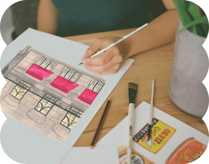 Illustrator Laura Page working on a spread