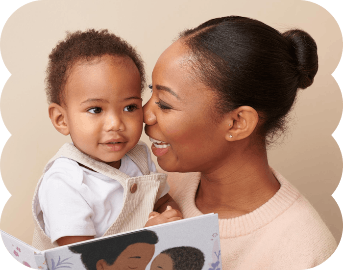 mother and child hugging reading personalised book
