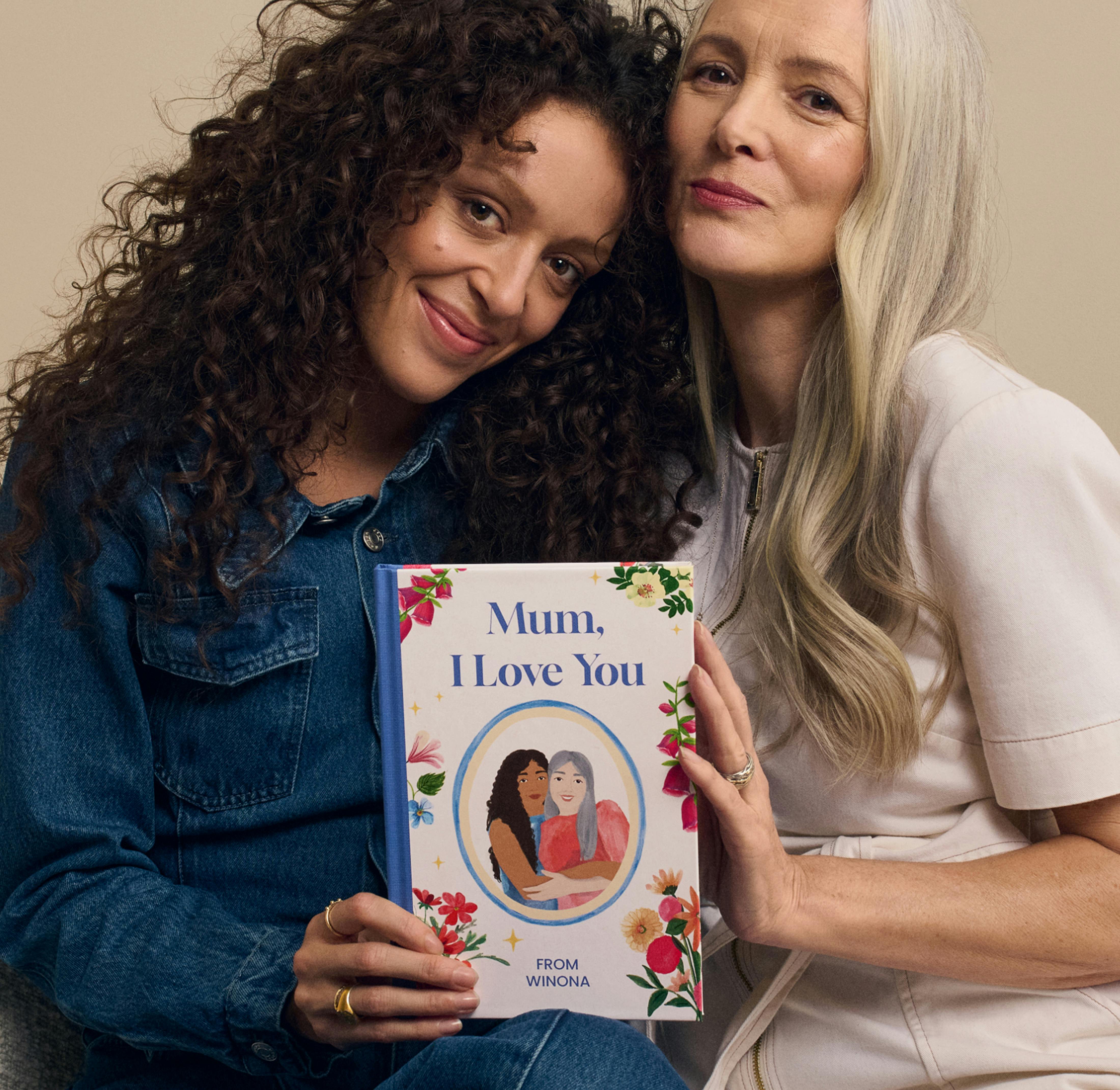 A daughter and mother holding the personalised book