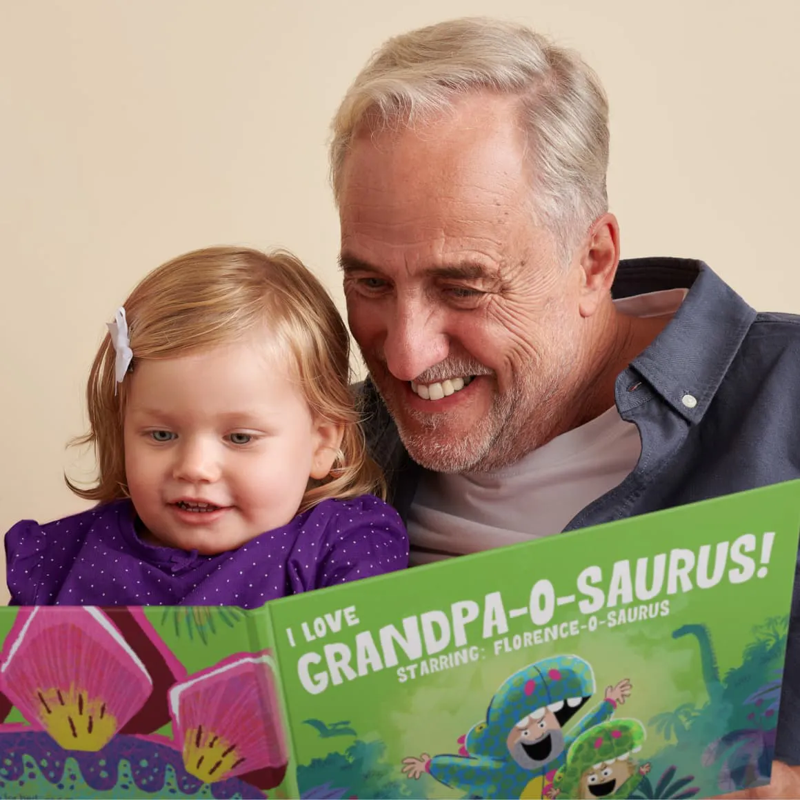 A child and grandpa reading the personalized book