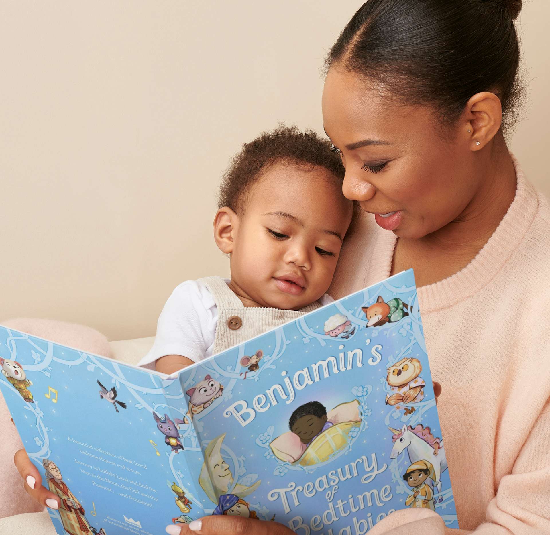 Parent and child reading Treasury of Bedtime Lullabies