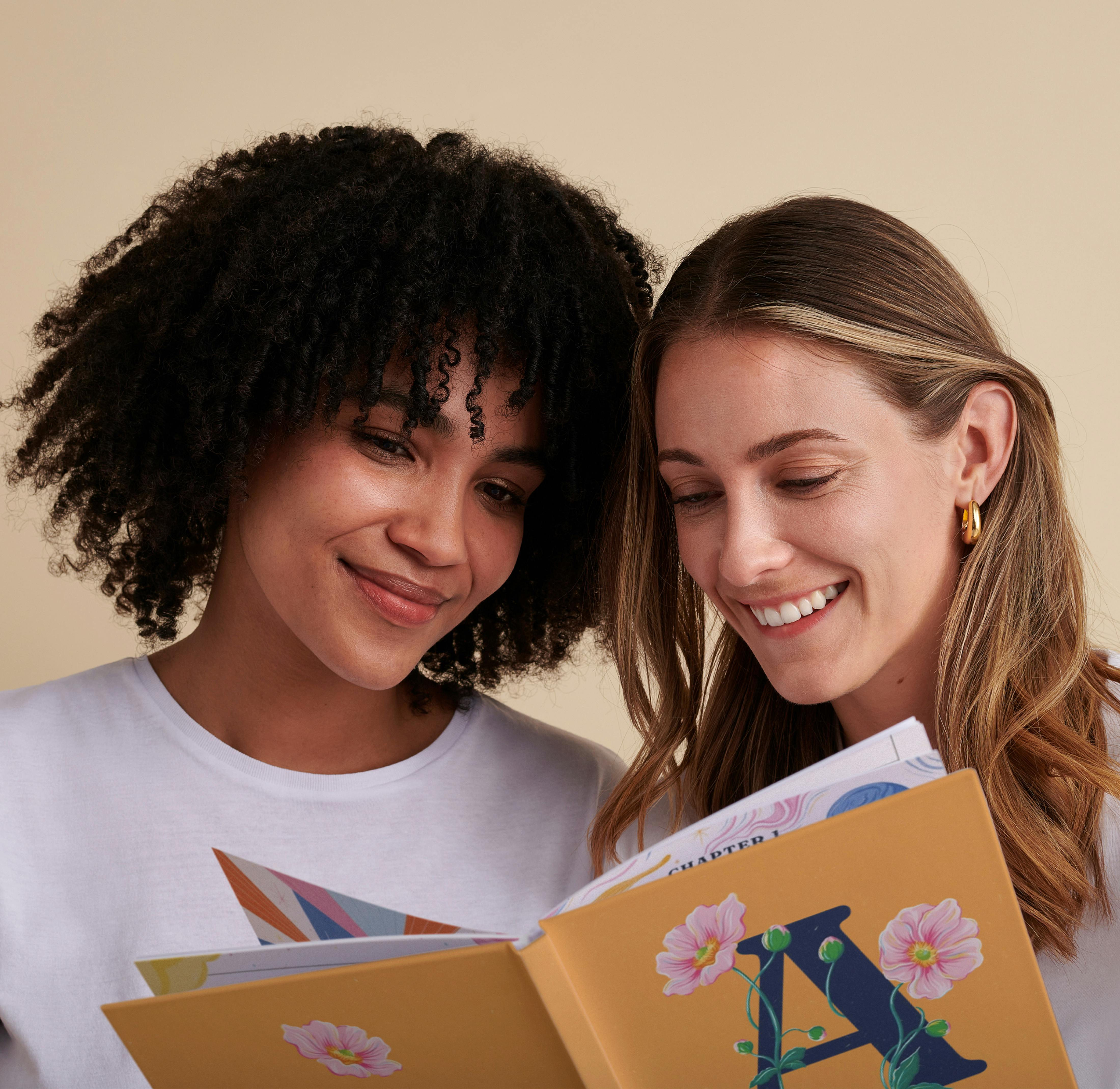 two girls reading personalised book