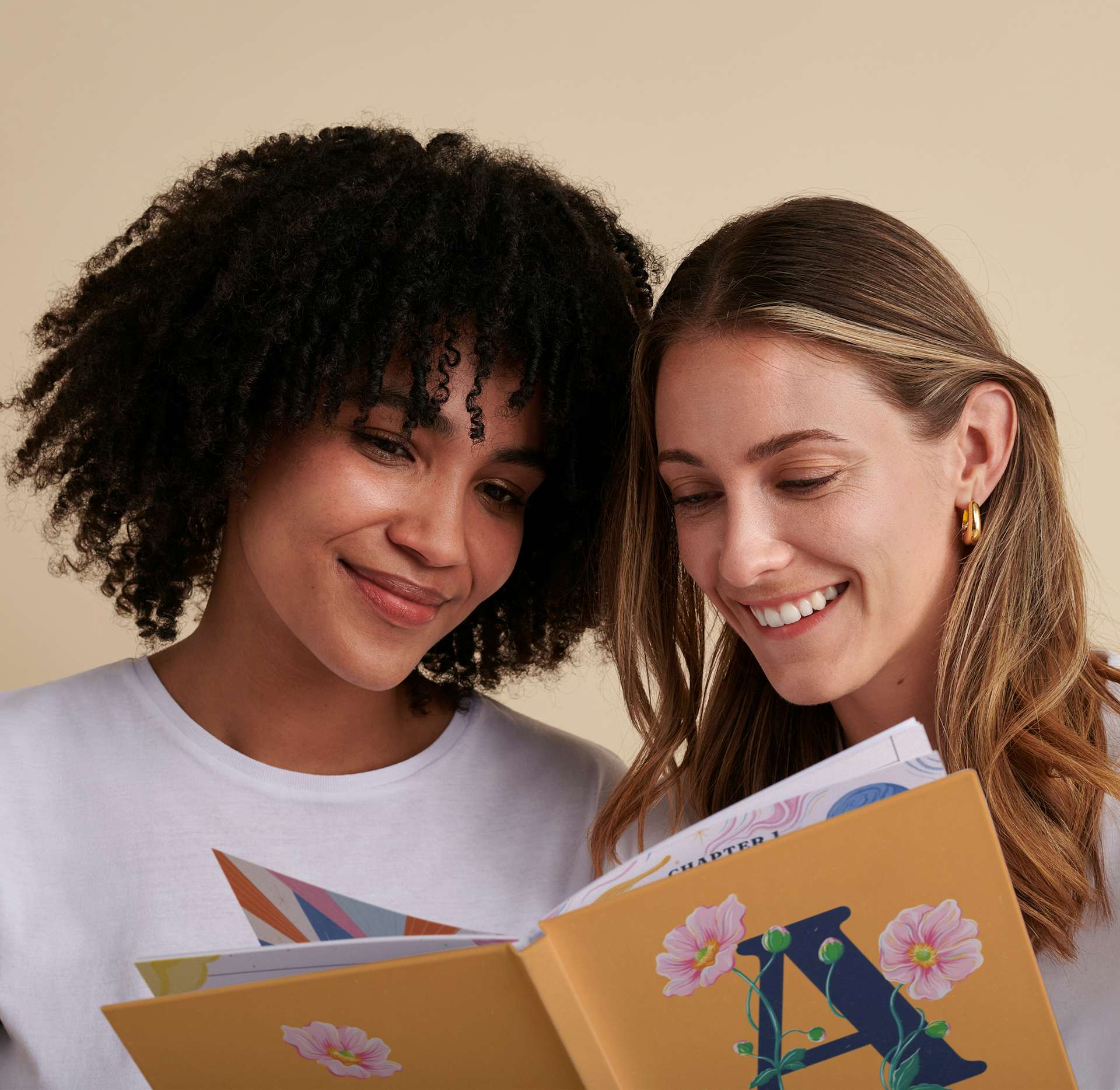 two girls reading personalised book