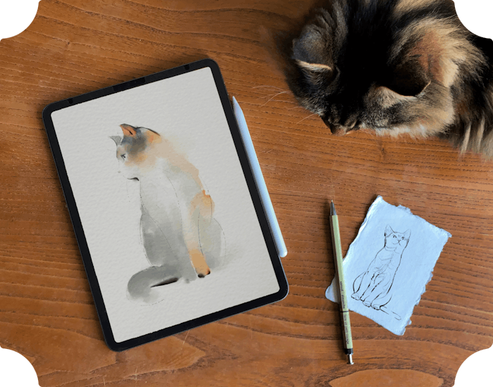 Cat drawing on a tablet on a desk