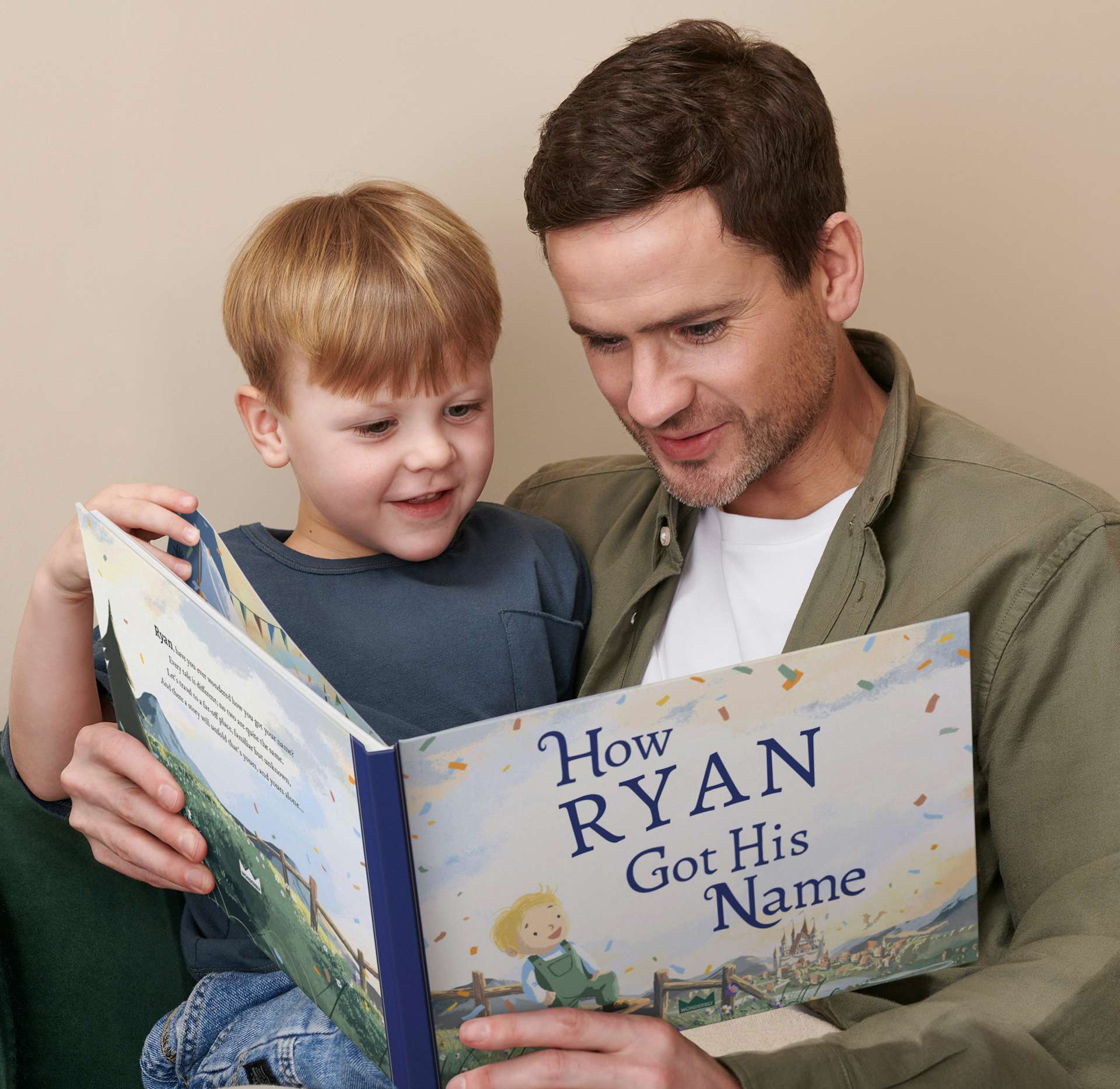 A child and father reading the personalised book