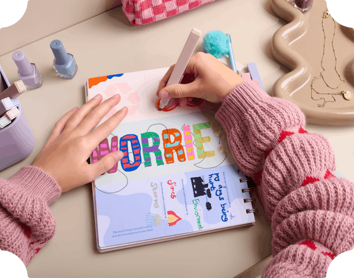 child writing in personalised journal book