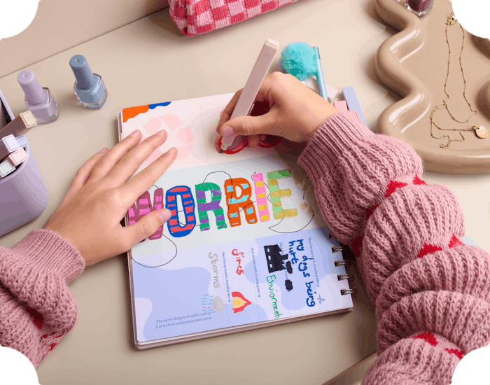 child writing in personalised journal book