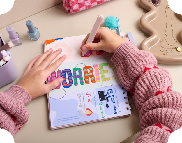 child writing in personalised journal book