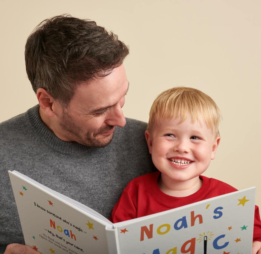 father and child reading personalised book