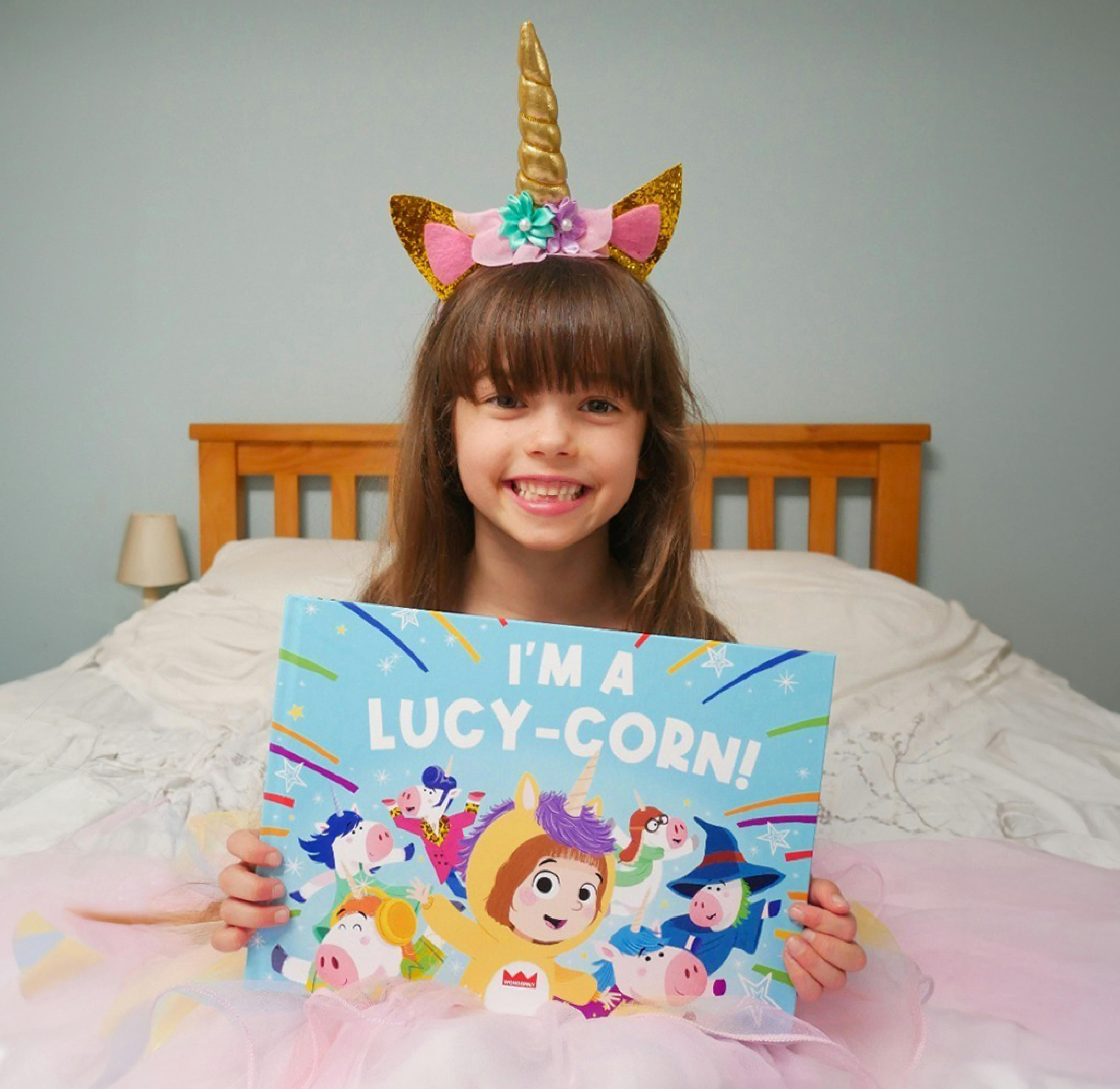 Child holding their personalised book