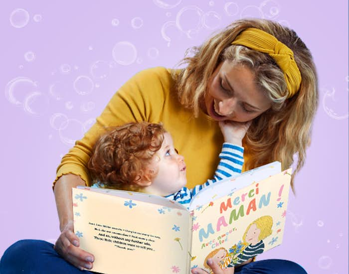 Mother and child reading Thank You, Mommy together