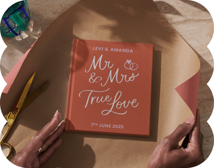 Two hands wrapping the personalised book