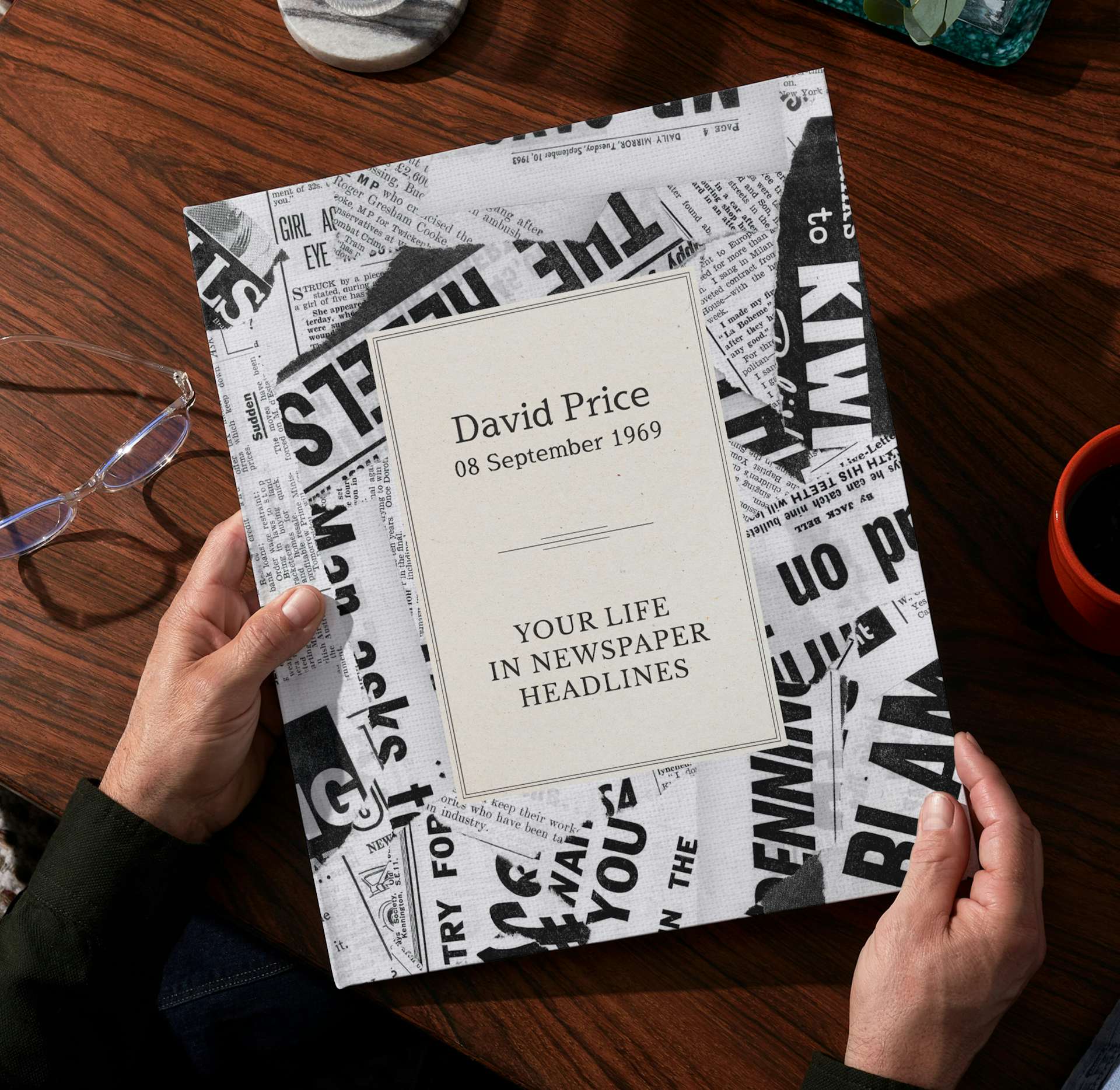 Two hands holding the open personalised book