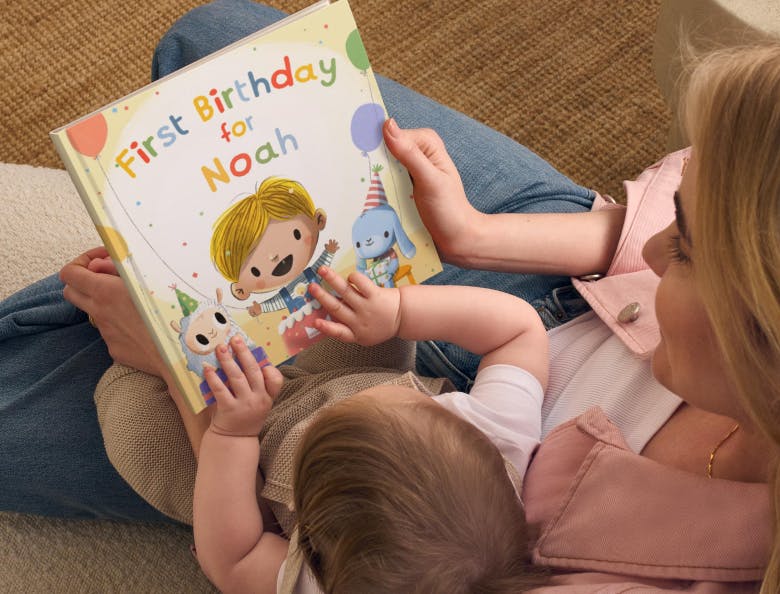 Mum and baby reading First Birthday for You 