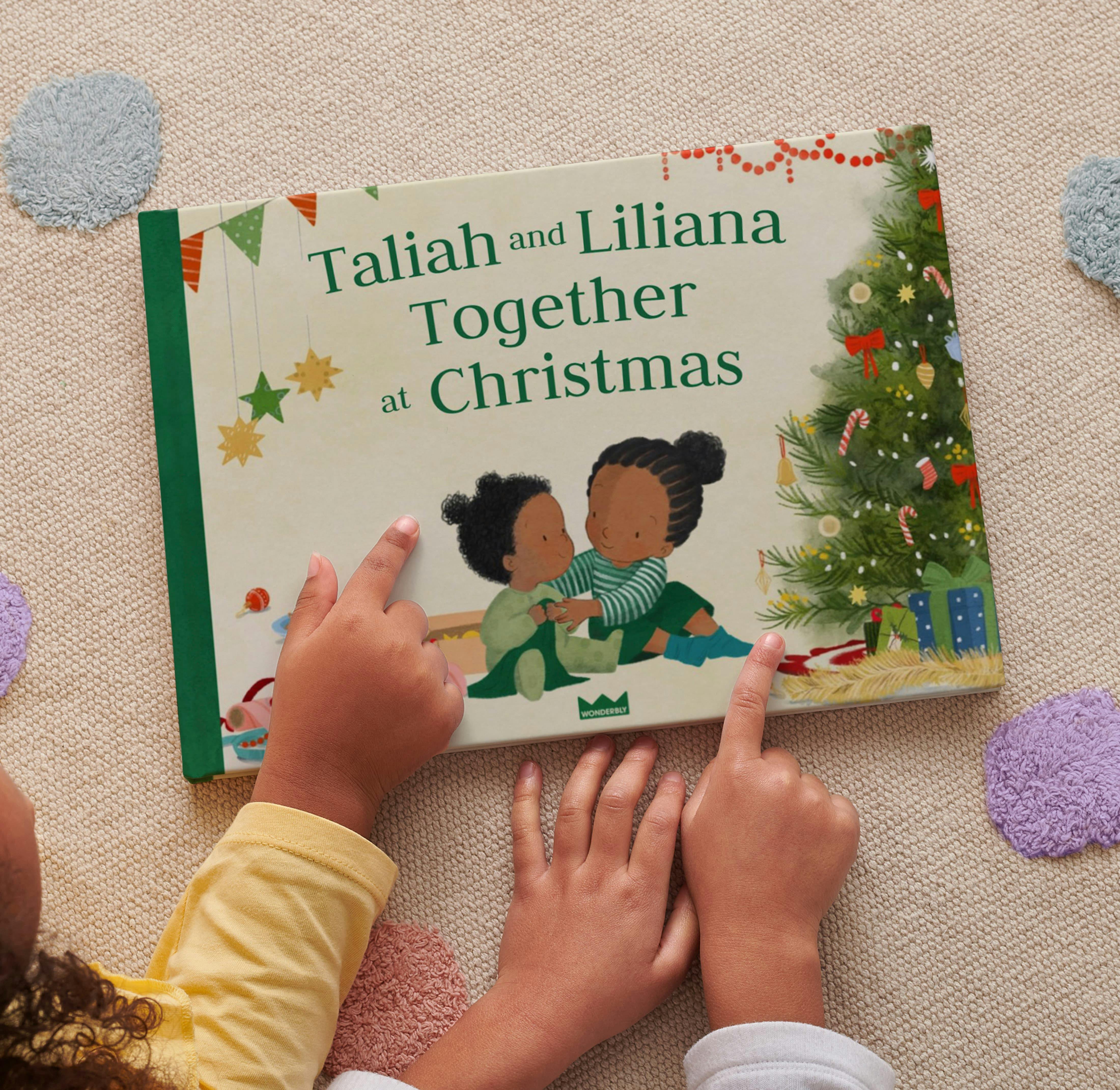 two children pointing to their personalised book