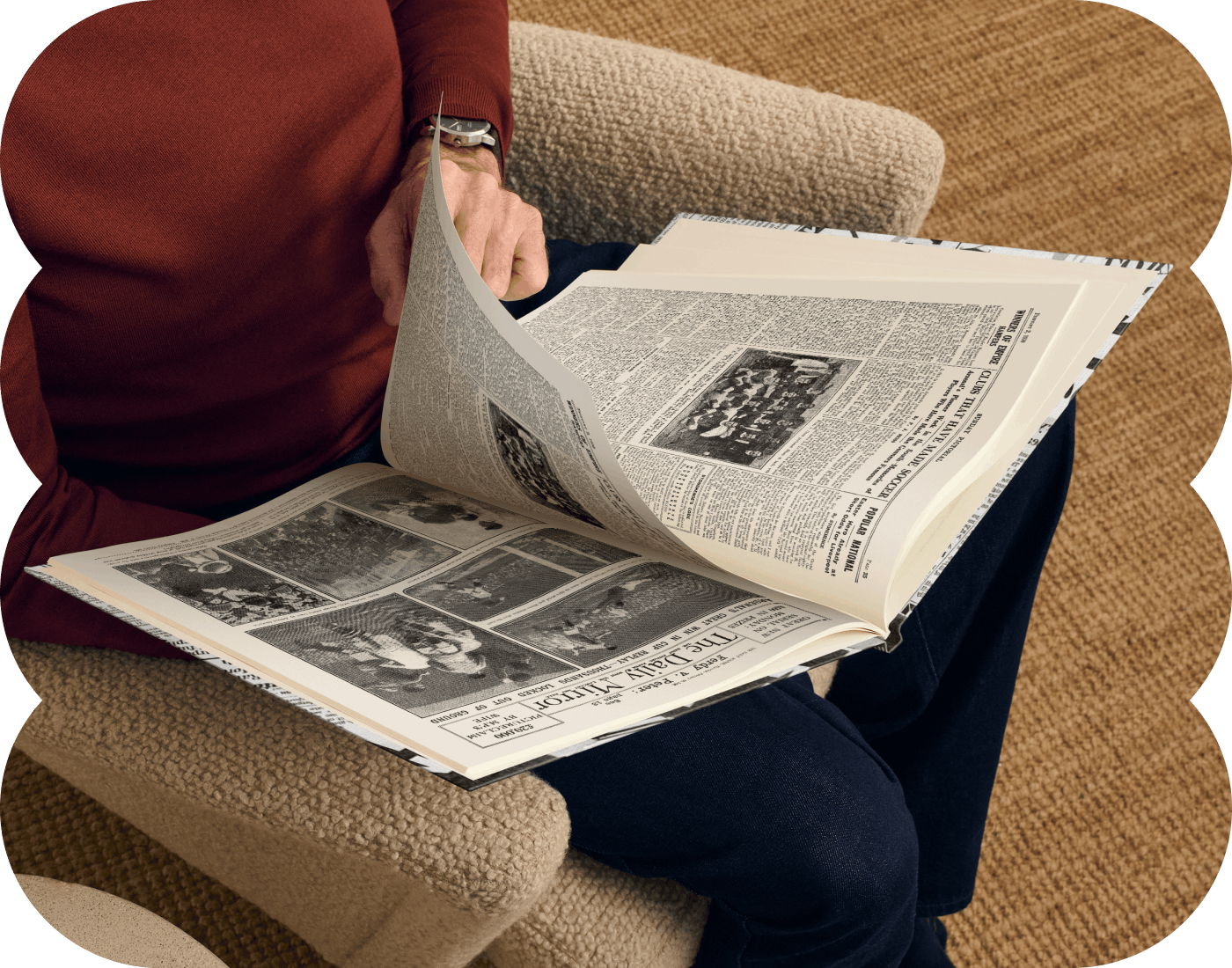 An adult reading their newspaper book