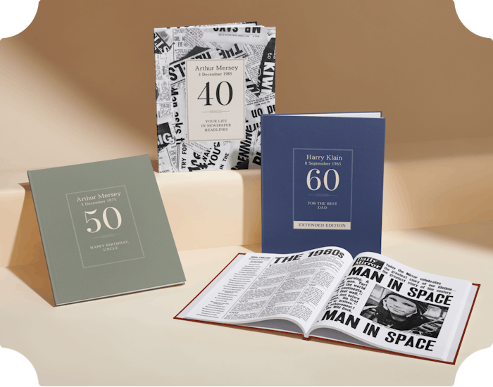Three personalised book covers and an  open newspaper book
