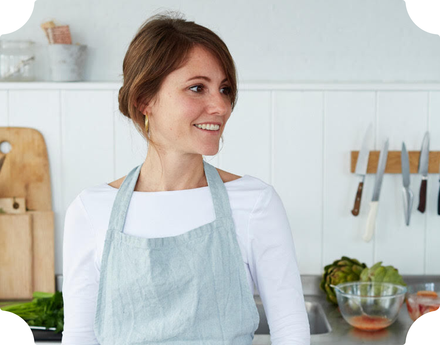 Woman in the kitchen with an apron on