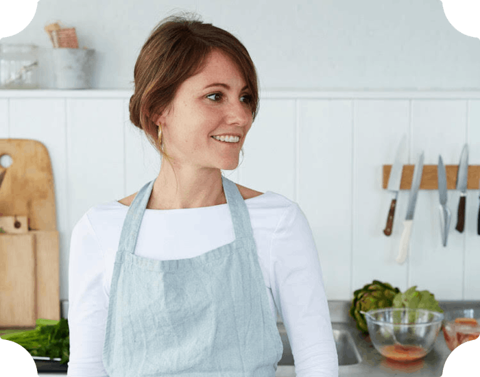 Woman in the kitchen with an apron on