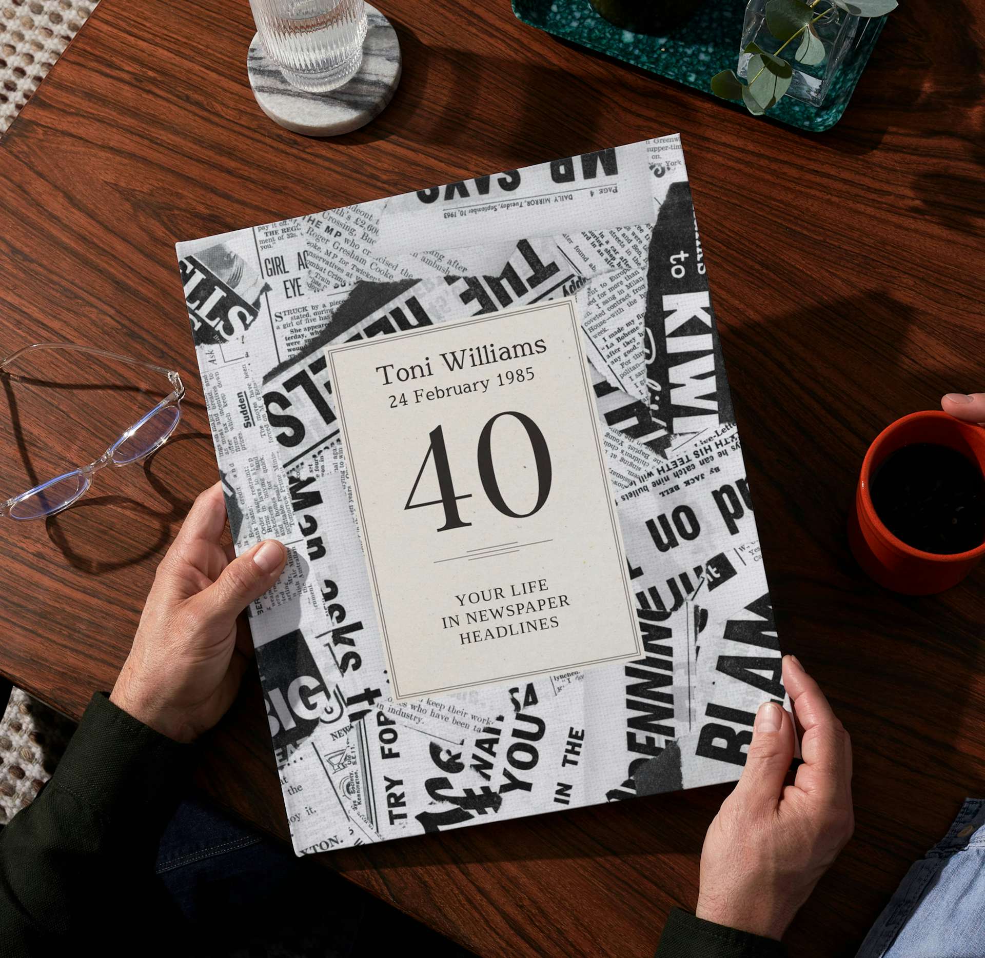 two hands holding the personalised book