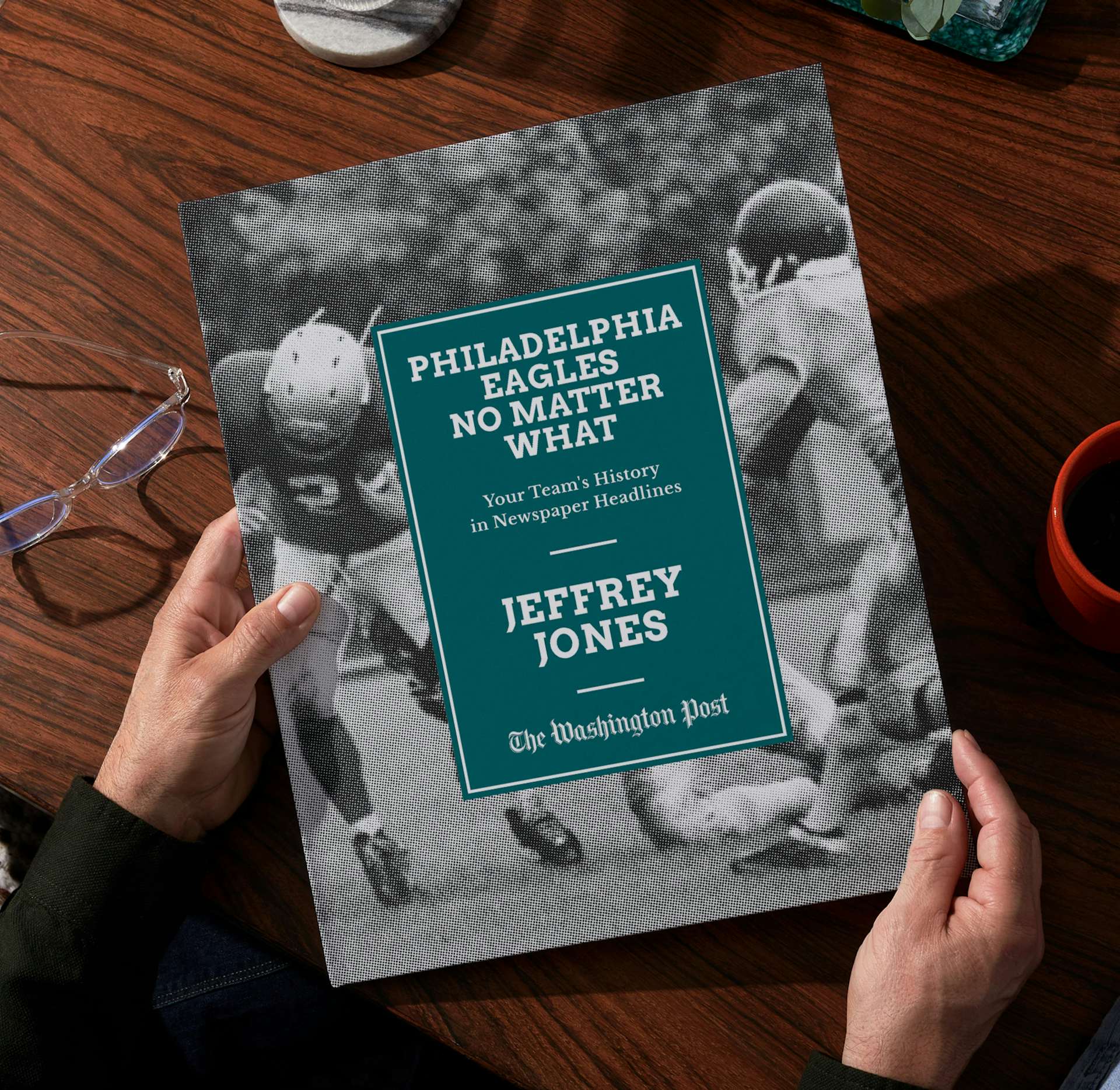 Two hands holding the personalized book