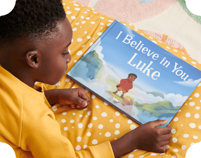 Child holding their personalised book